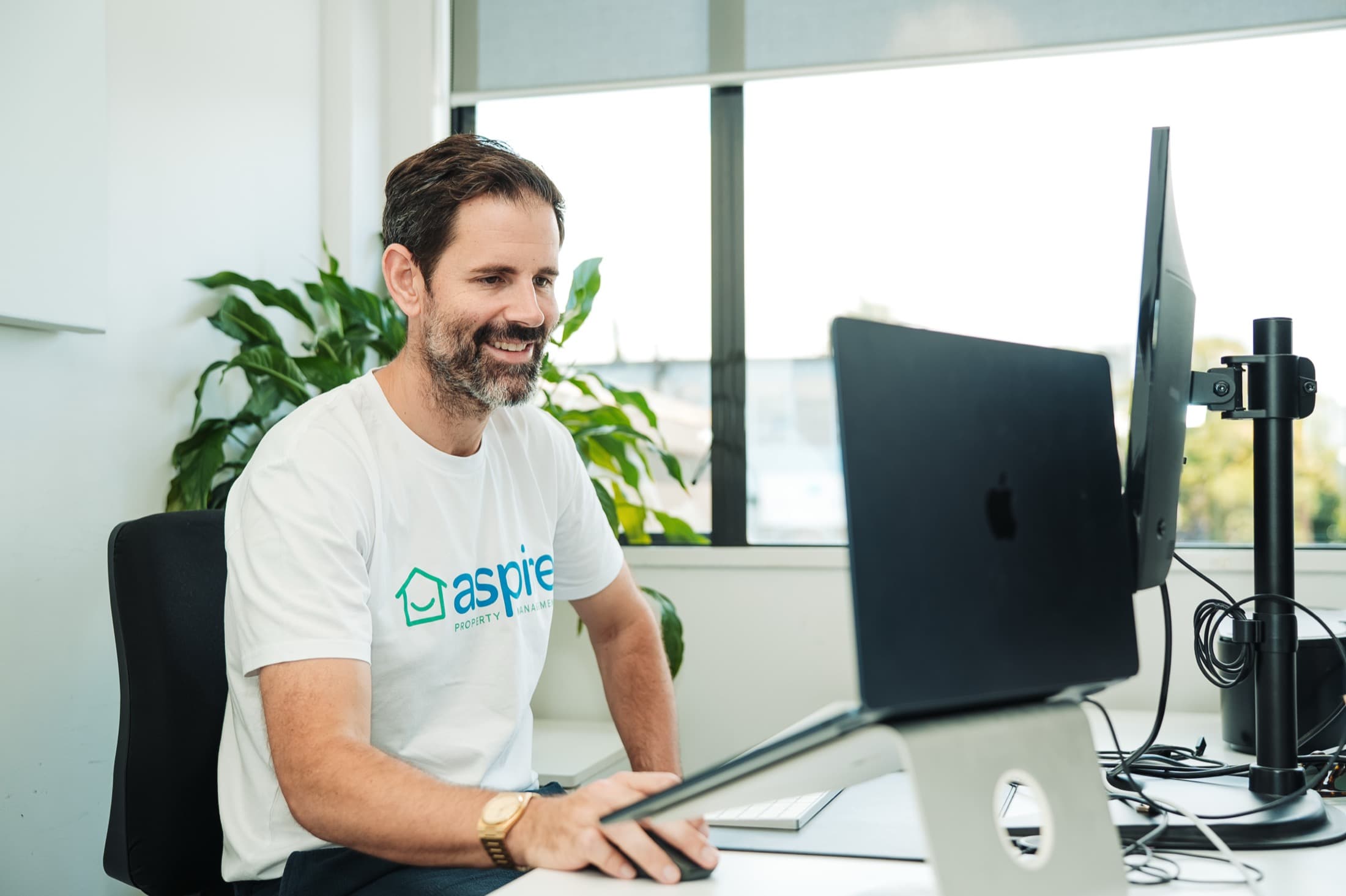 An Aspire team member at work in the Takapuna office